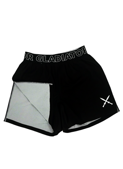 Black athletic shorts with mesh lining and 'Gladiator' branding on a light gray background